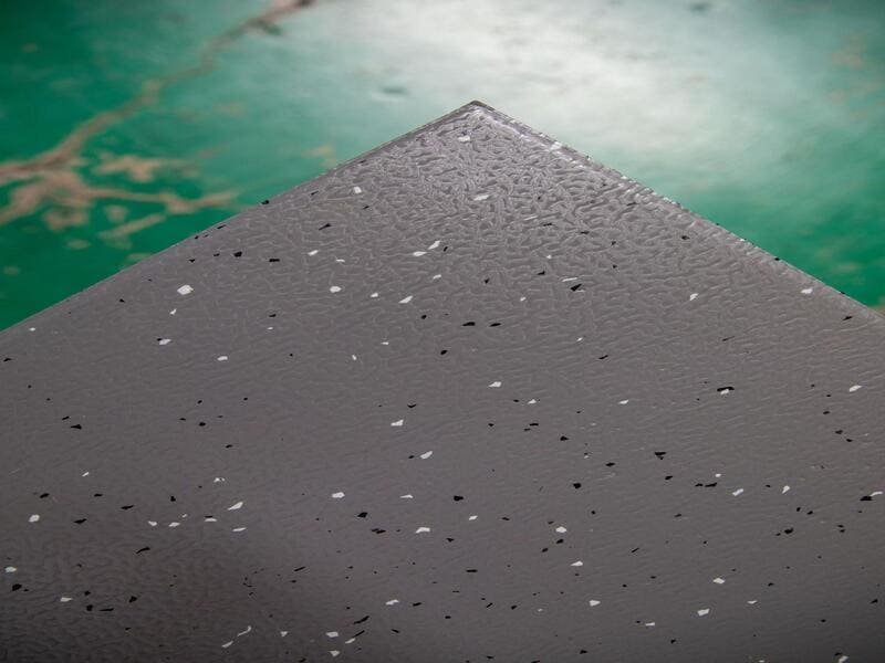 beveled edge transition strip on gym rubber floor
